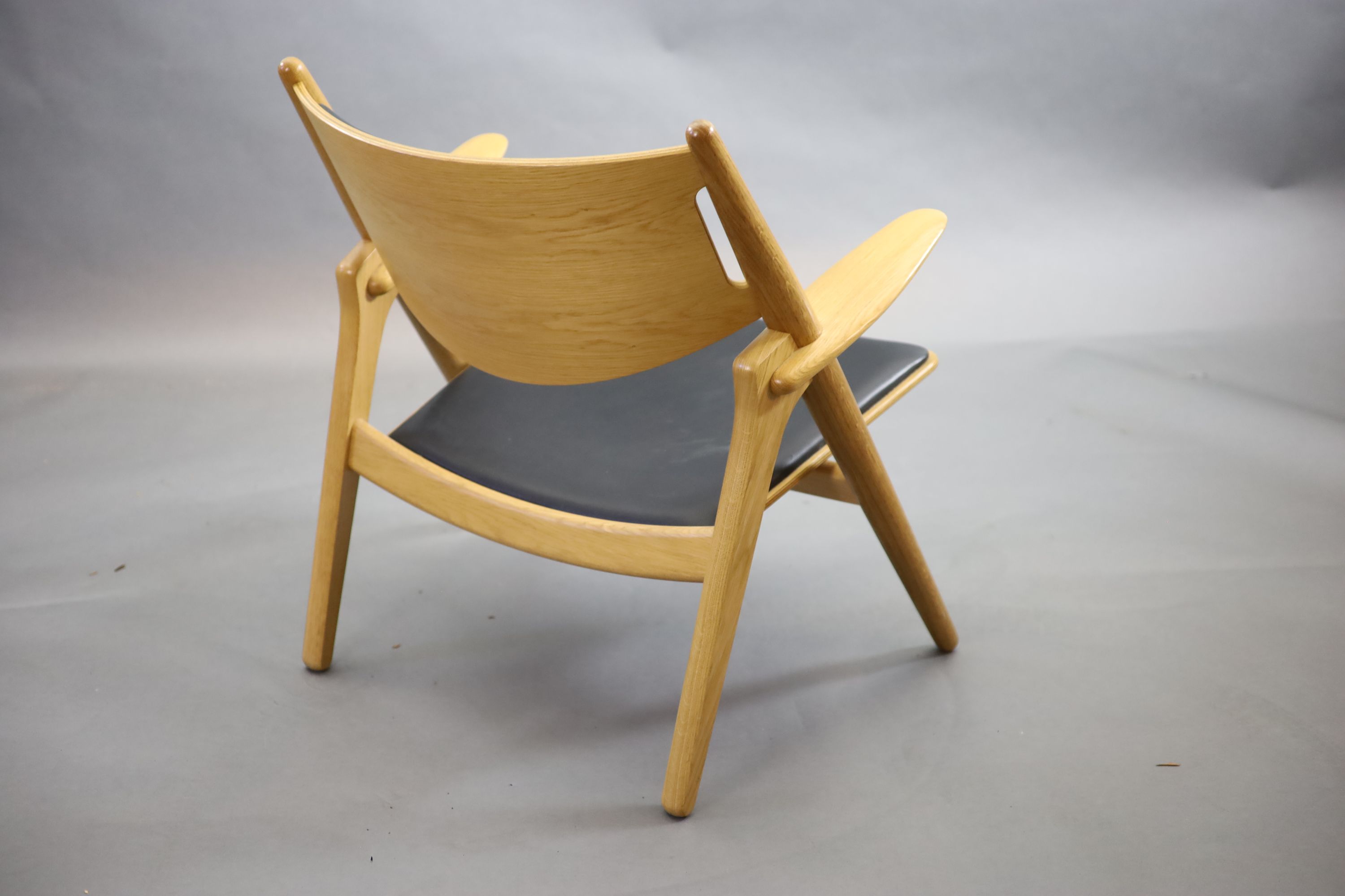 Hans Wegner for Carl Hansen, an oak and oak laminate framed ‘Sawback’ armchair, 73cm high, 52cm deep, 76cm high